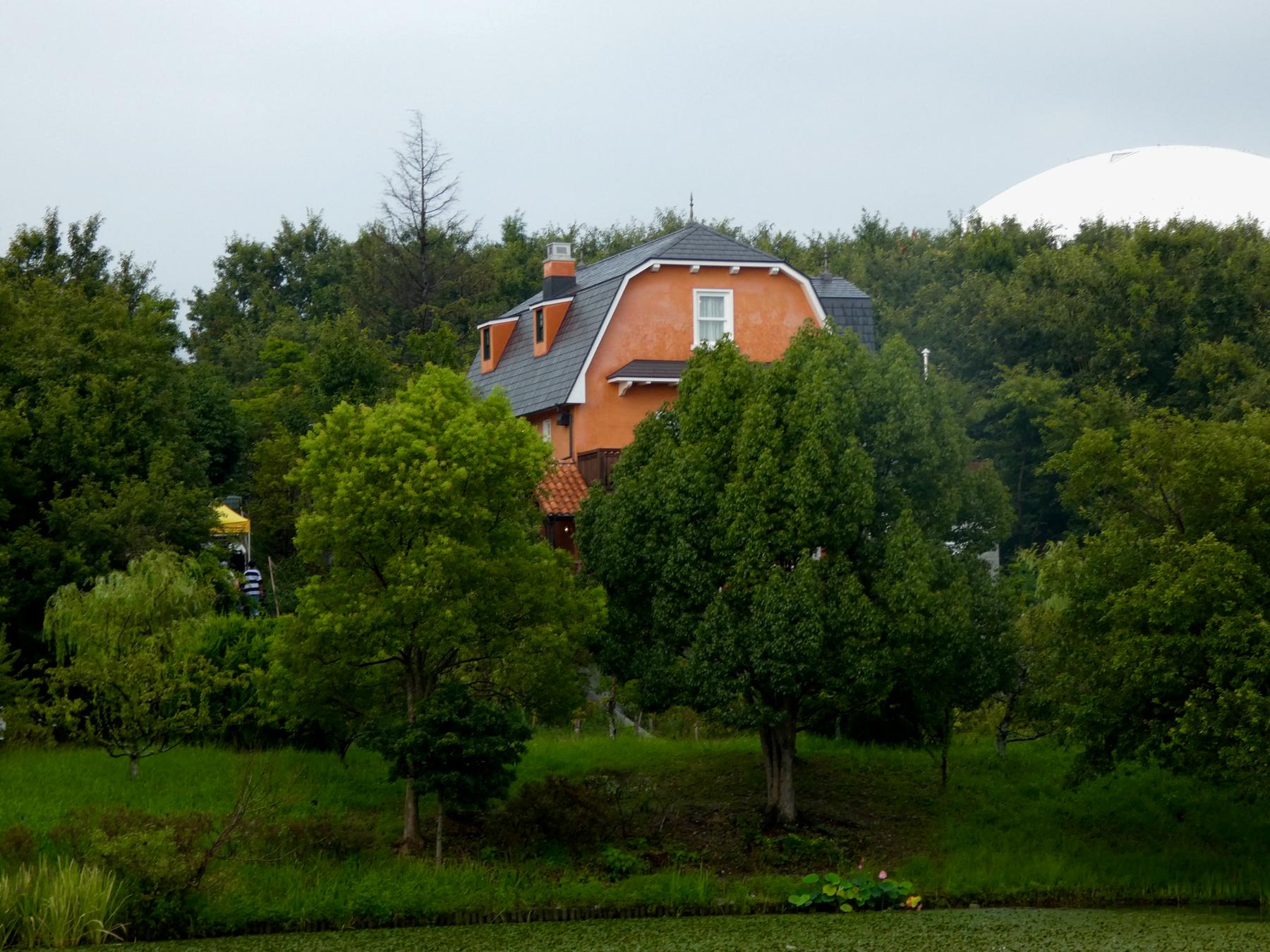 Hill of Youth area at Ghibli Park with its distinctive tower and greenery