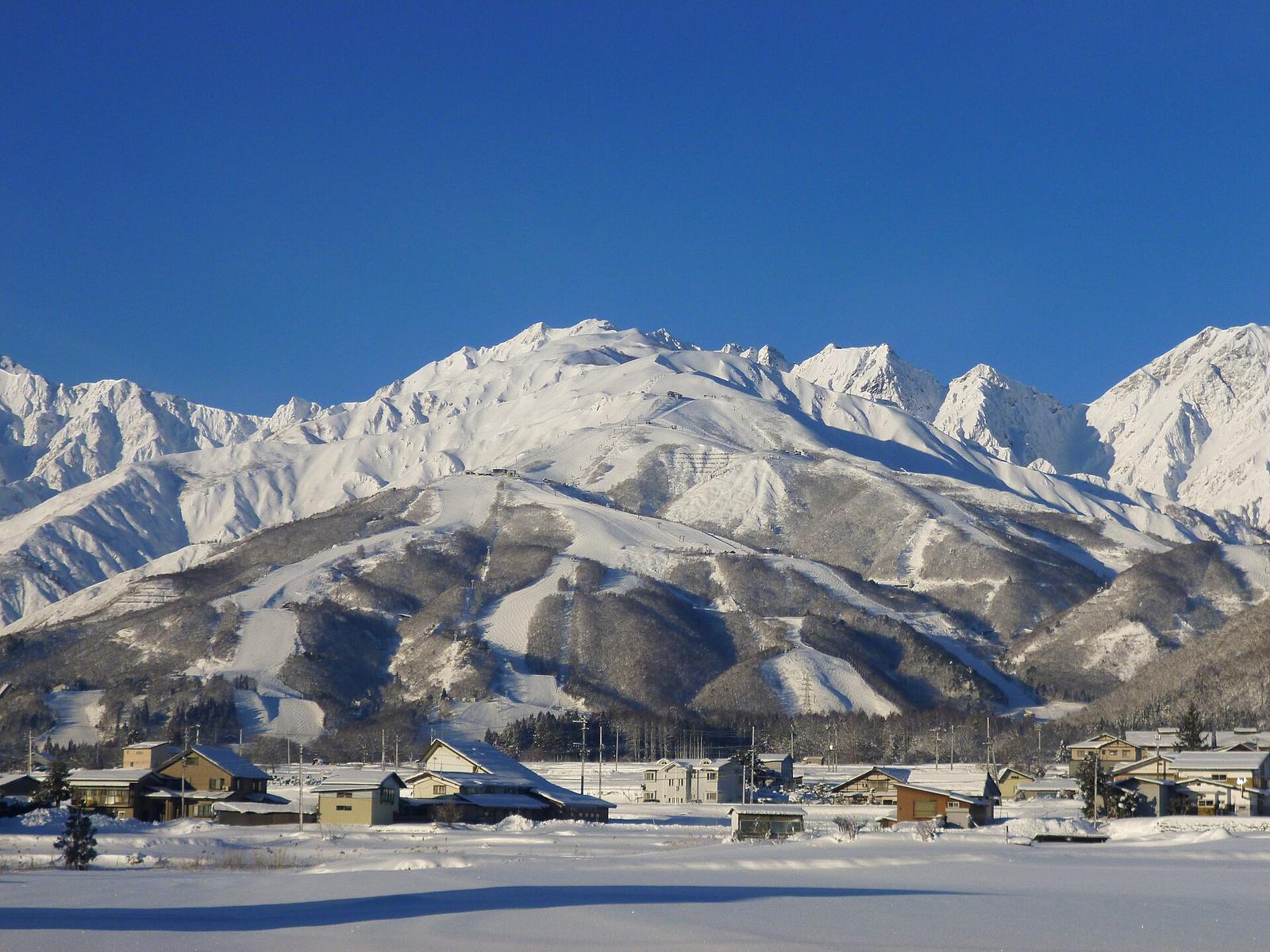 Snow-covered peaks and ski runs above the village of Hakuba in the Japanese Alps